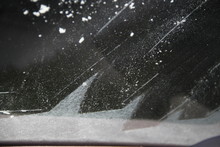 Squeegee Frosted Windshield In The Morning