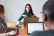 © nenetus - Three business colleagues working together in modern workspace. Brainstorming concept.