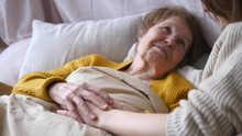 Family, Support, Elderly Care, Assistance, Seniors Concept. Grandmother In Bed.