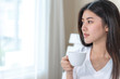© suphaporn - Beautiful woman drink coffe in the morning