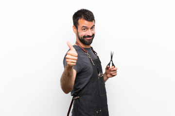 Barber man in an apron with thumbs up because something good has happened