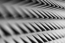 Grey Acoustic Foam Pyramid Repeating Background For Music Studio. Black And White. Close-up View With Shallow Depth Of Field