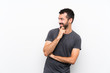 © luismolinero - Young handsome man over isolated white background looking to the side