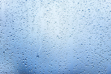 Window with Drops after heavy Rain, Water Drops on Glass as Background or Texture