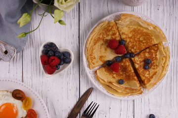 Wall Mural - Breakfast with pancakes and fried eggs