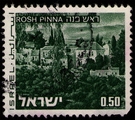 Wall Mural - ISRAEL - CIRCA 1971: stamp 0.5 Israeli lira printed by State of Israel, shows view of Rosh Pinna town local council in the Korazim Plateau of Israel, circa 1971