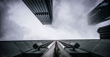 Modern Office Buildings Against Sky In Foggy Weather