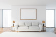 © ImageFlow - White living room with white sofa and poster