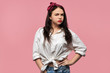 © Anatoliy Karlyuk - Sad frustrated beautiful young female with loose black hair expressing negative reaction on offense or insult, having sulky facial expression, keeping lips pouted. Indignant lady posing isolated