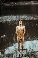 Naked Man Standing At Lake