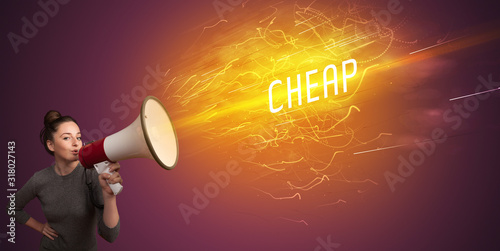 Cuadros en Lienzo Young girld shouting in megaphone with CHEAP inscription, online shopping concep