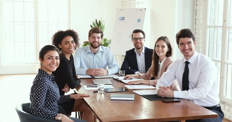 Sticker - Happy multicultural company board group posing at office meeting table