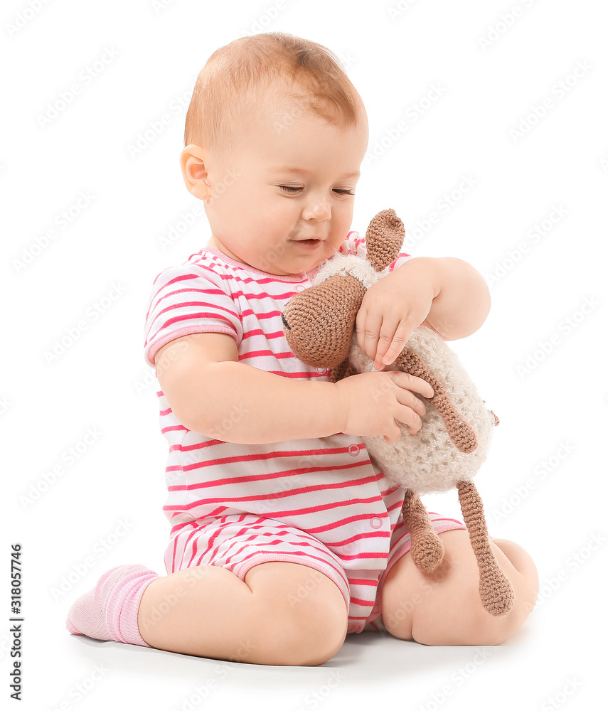 Cute little baby with toy on white background