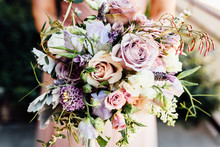 Close-Up Of Bride With Bouquet