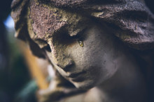 Death Concept. Close Up Of Ancient Statue Of Crying Angel With Tears In Face As Symbol Of End Of Human Life.