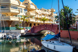 Fototapeta Mapy - PUERTO MARINA, BENALMADENA - DECEMBER 2019: Beautiful villages surrounded with water, private port and parked yachts, Andalusia, Spain