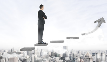 Wall Mural - Business man climbing up stair steps to career success with business district and horizon skyline as background. Concept of business goal success, growth of career path and starting up a new business.