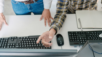 Pensive programmer working on desktop pc programming code technologies or website design at office Software Development Company