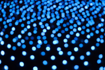 blue bokeh light abstracton on black background.