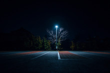 Illuminated Street Light On Footpath At Night