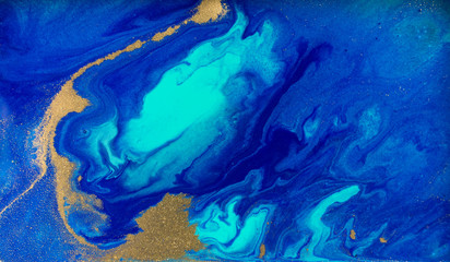 marbled blue and gold abstract background. liquid marble pattern.