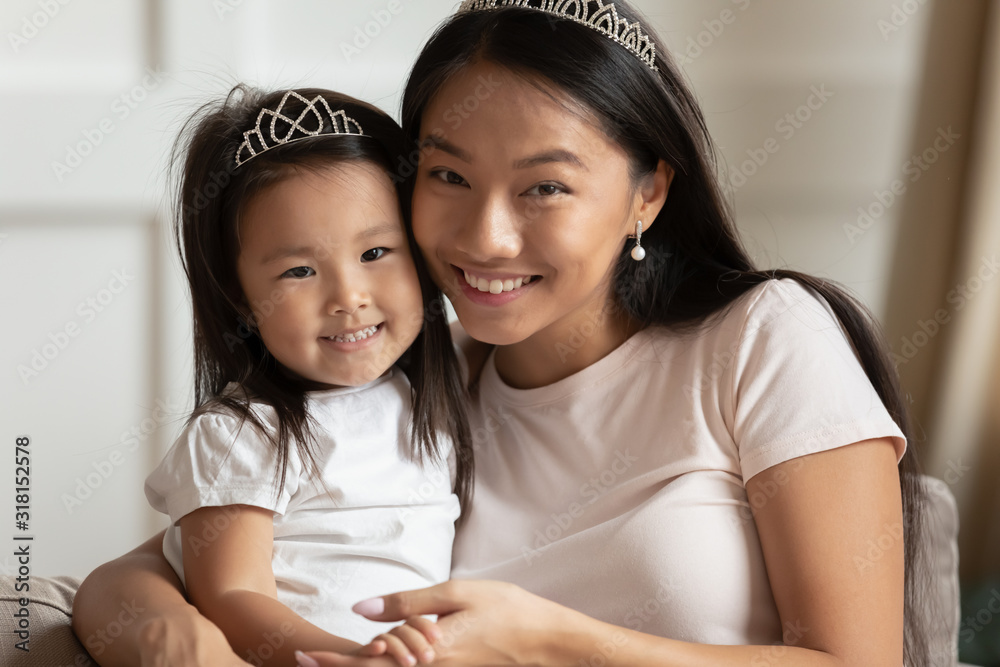 Portrait of young Asian mom and daughter posing at home - obrazy, fototapety, plakaty 