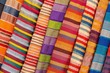 Closeup shot of different colorful Asian textiles with stripes