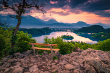 Wooden Bench And Beautiful View With Lake Bled At Sunset