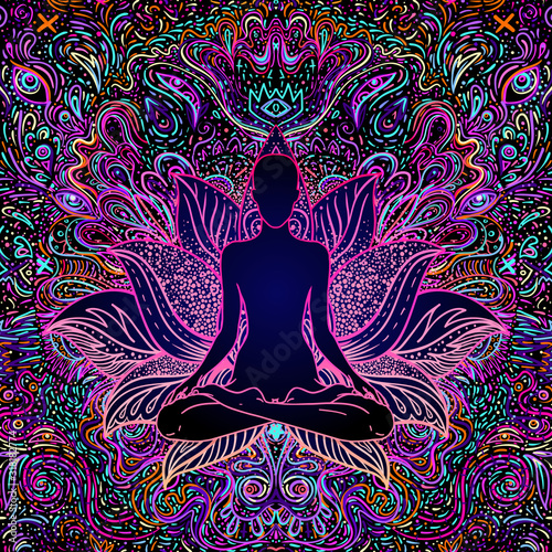 Photographie Sitting Buddha over colorful neon background