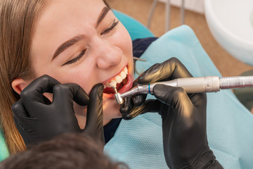 Wall Mural - brushing teeth in the dental office