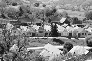 Typical rural landscape and peasant houses in  the village Alma Vii (Almen) Transylvania, Romania. The settlement was founded by the Saxon colonists in the middle of the 12th century