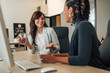 © bnenin - Friendly business partners discussing at workplace.