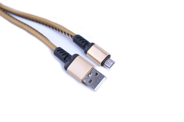 Wall Mural - Folded USB lightning charging smartphone golden cable isolated over the white background