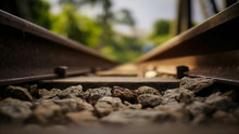 Close-Up Of Stones At Railroad Tracks