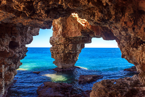 Natural cave on the coast in Spain, Moraira, Alicante, Cova dels Arcs