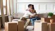 © fizkes - Happy couple hug on couch excited to move together