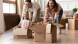 © fizkes - Overjoyed family have fun on moving day