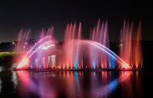Night Show Of Color Fountains. Beautiful Fountain Show. Dancing Fountain At Lantan Scenic Area In Taiwan