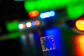 Sticker - microfluidic device Instrument that uses micro amounts of fluid on a microchip to do certain laboratory tests.