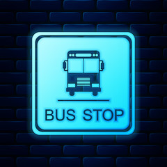 Poster - Glowing neon Bus stop icon isolated on brick wall background. Vector Illustration