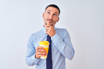 Sticker - Young business man holding take away coffee over isolated background serious face thinking about question, very confused idea