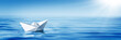 Small White Paper Boat In Big Ocean With Blue Sky And Sunshine - Business Opportunity/Vision Concept