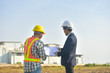© Suriyo - Project Manager taking with Engineer construction plan project building factory construction