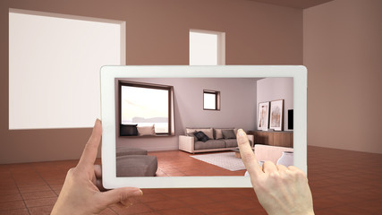 Wall Mural - augmented reality concept. hand holding tablet with ar application used to simulate furniture and de