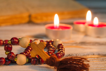 Wall Mural - Prayer beads rosary with wooden cross closeup. Divine service, reading manuscript, God praying rithual.