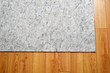 © Michael Gray - area rug felt under pad on hardwood floor