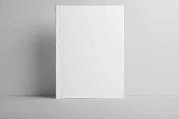 Real photo blank portrait A4, US-Letter, brochure magazine mockup isolated on gray background.