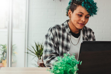 young girl with laptop at home or in the office