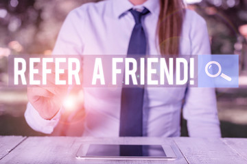 Poster - Conceptual hand writing showing Refer A Friend. Concept meaning direct someone to another or send him something like gift Female business person sitting and holding mobile phone