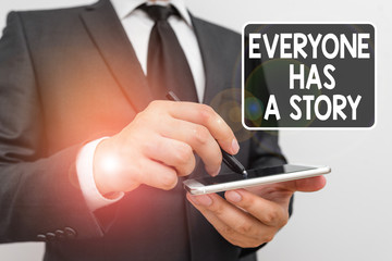Poster - Writing note showing Everyone Has A Story. Business concept for Background storytelling telling your memories tales Male human wear formal work suit hold smartphone using hand